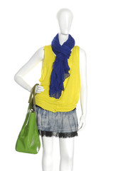 female dress with blue scarf and bag on mannequin