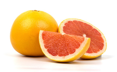 Fototapeta na wymiar Cut red grapefruit isolated on white background