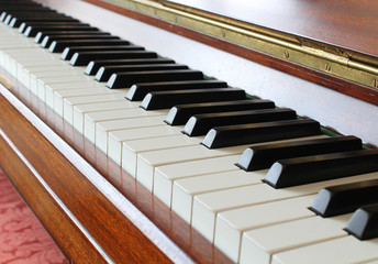 Piano key closeup on a wooden piano