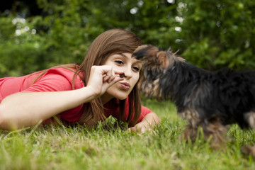 Woman feeding puppy