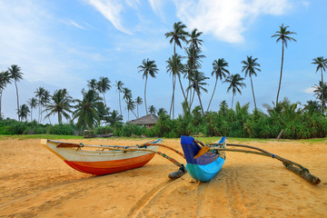 Fishing boats on a tropical beach