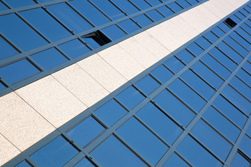 facade of office building with blue reflected