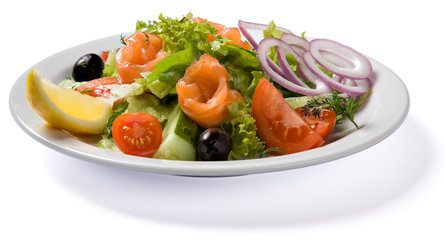Salad with salmon served on white plate