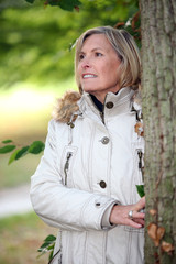 woman next to a tree