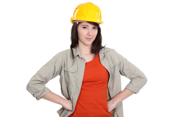 Confident young female builder