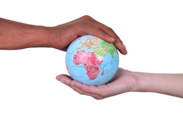 Hands cupped around a globe