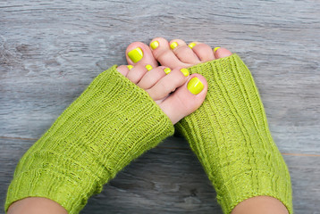 Green female pedicure