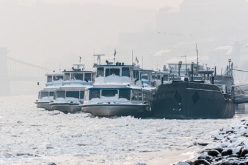 Big boats stuck in the ice at winter