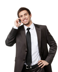 Businessman talking on the cellphone, isolated on white