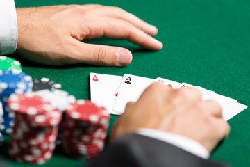 Naklejka premium Poker player opens his cards. Challenge to the casino