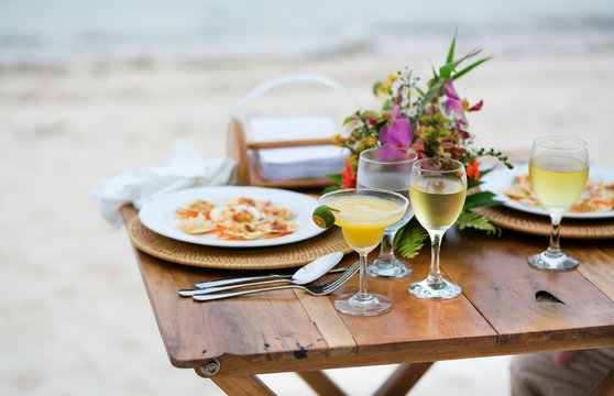 Romantic dinner served for two on a beach