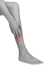 Women scratch itchy leg with hand.