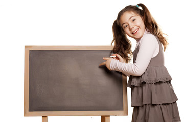 little girl pointing to a table