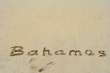 Fototapeta na wymiar Conceptual handwritten text Bahamas in sand