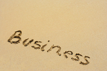 Business handwritten in sand