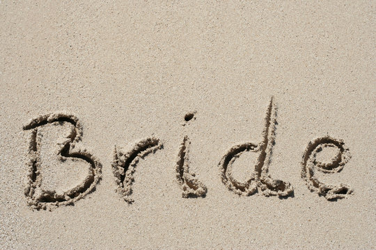 Bride handwritten in sand