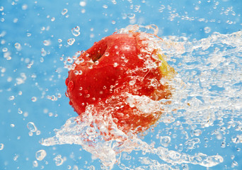 apple in a jet of water.