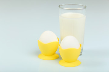 Milk in a glass jar and eggs
