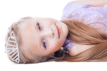 Beautiful little girl lay with tiara on head © Wisky