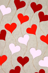 Hearts garlands on linen background