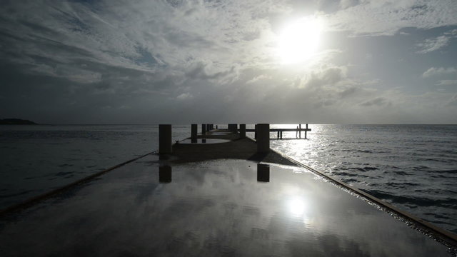 Pier stretching into the horizon of the Caribbean Time Lapse