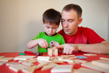 Happy family. Father and son working at home