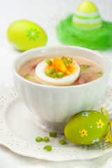 White borscht with eggs and white sausage.Polish easter soup