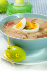 White borscht with eggs and white sausage.Polish easter soup