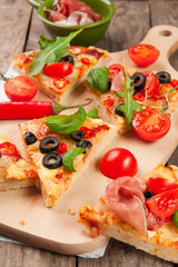 Pizza with ham, pepper and olives on old wooden background - obrazy, fototapety, plakaty