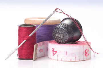 Old thimble and needles with thread