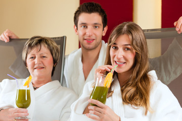 Wellness - People in Spa with Chlorophyll-Shake