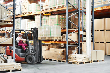worker driver at warehouse forklift loader works © Kadmy