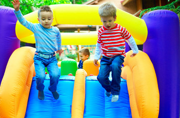 Fototapeta na wymiar young kids having fun on playground