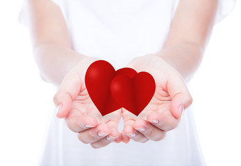 Heart on woman hands over body isolated on background.