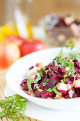 nutritious salad with beets in a white bowl
