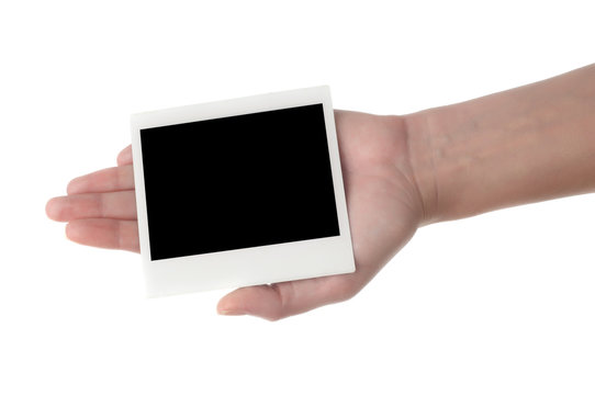 hand holding photo frame