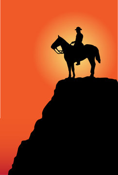 man on the horse at sunrise or sunset