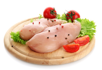 raw chicken meat on cutting board, isolated on white