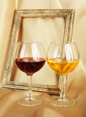 composition of frame and wine on bright background