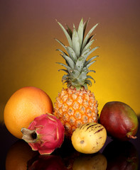Composition of exotic fruits on colorful background