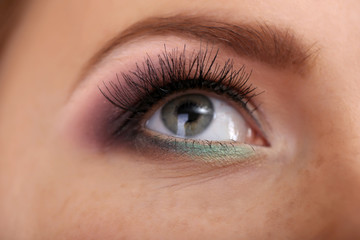 Fototapeta na wymiar Beautiful female eye with bright make-up, close up