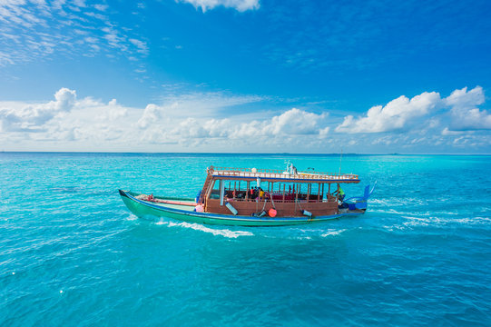 Wooden Maldivian traditional dhoni boat on a sunny day