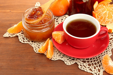 light breakfast with tea and homemade jam, on wooden table