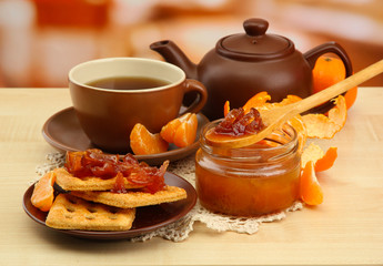 light breakfast with tea and homemade jam, on wooden table