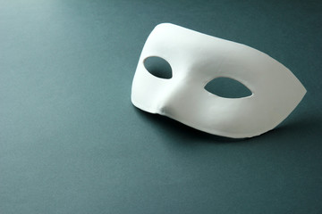 White mask, on grey background