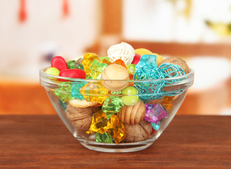 Fototapeta premium Dried oranges, wicker balls and other home decorations in glass