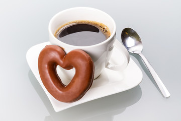 Gingerbread heart with coffee as a love symbol