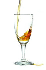 pouring whiskey into wine glass