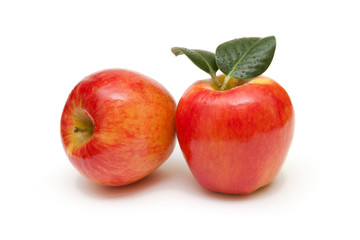 Red apples fruit with leafs on white background