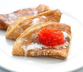 Pancakes with red caviar